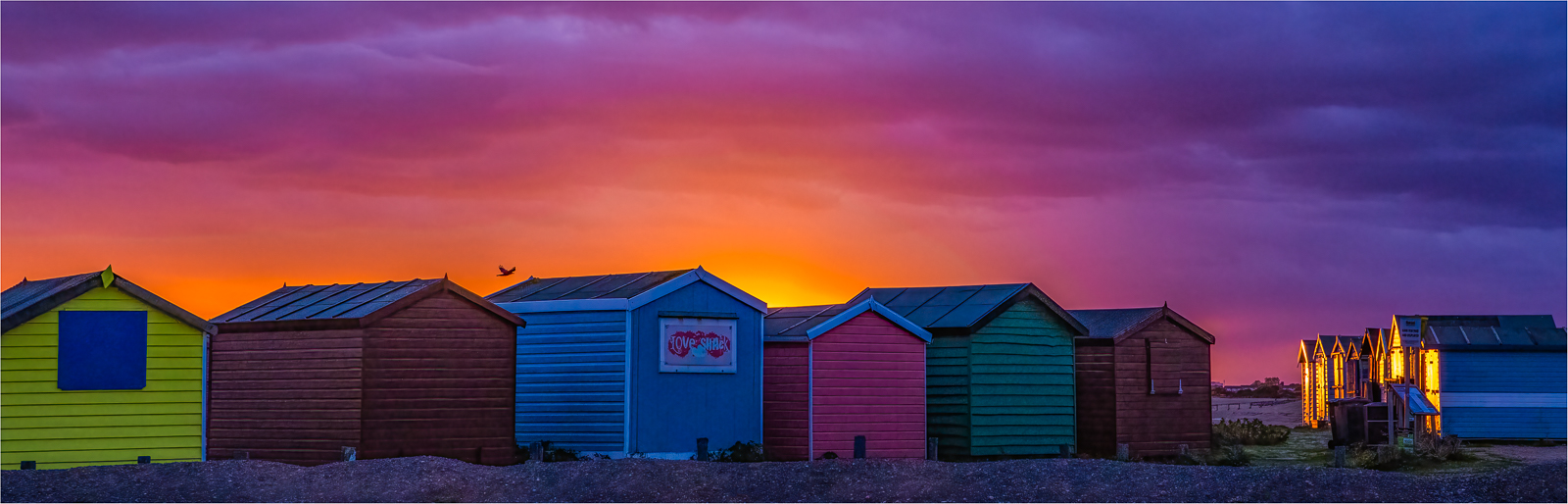 June &dash; Debbie McIlroy &lsquo;Beach Huts on Fire&rsquo;